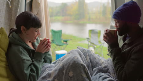 Camping,-coffee-and-a-happy-couple-with-a-toast