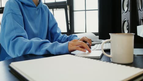 woman working on computer at desk