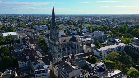 smooth sideways aerial movement around the saint-clement church at daytime, nantes, france