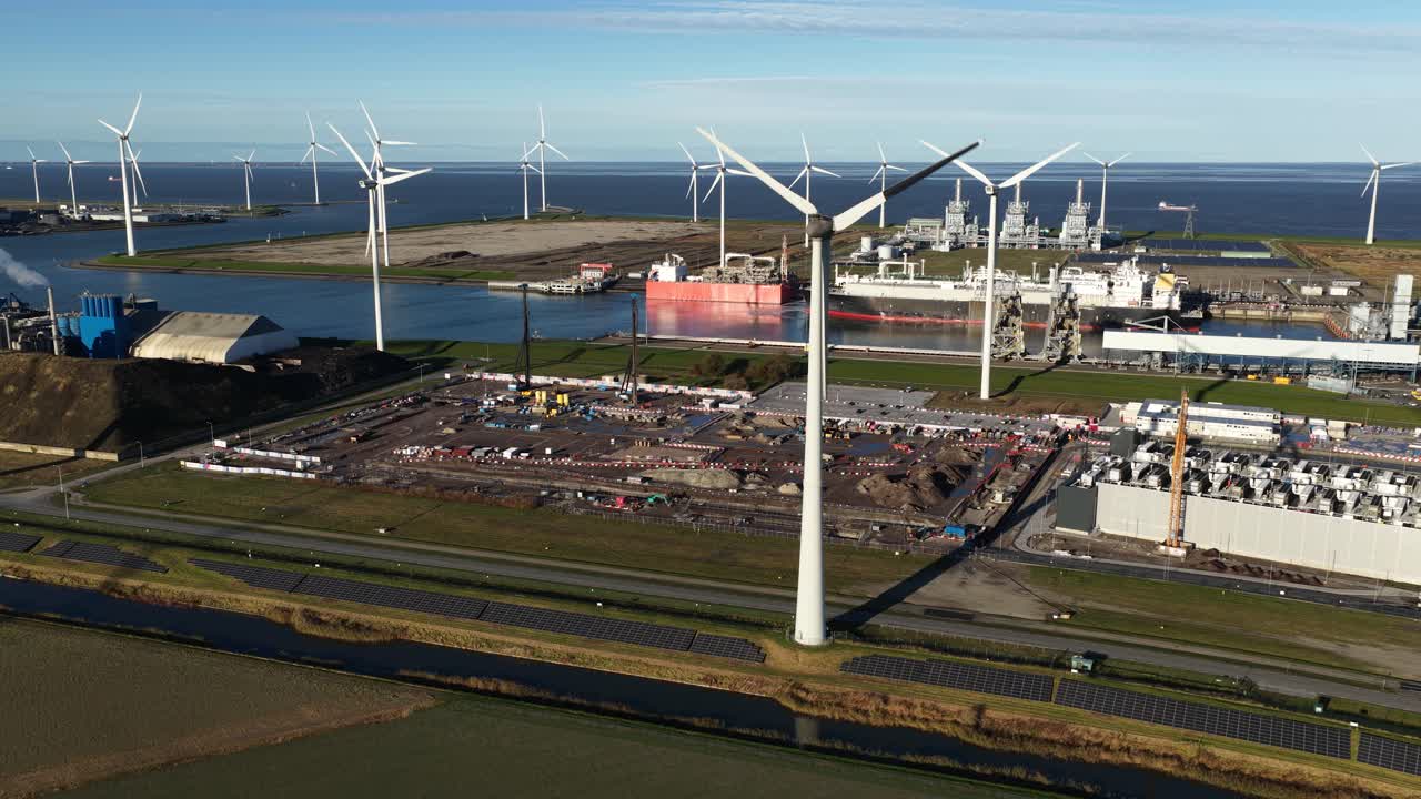 Drone view of data center complex in Eemshaven, Groningen, showing new construction next to the existing facility. Illustrates rapid expansion driven by AI, Big Data, and cloud services demand