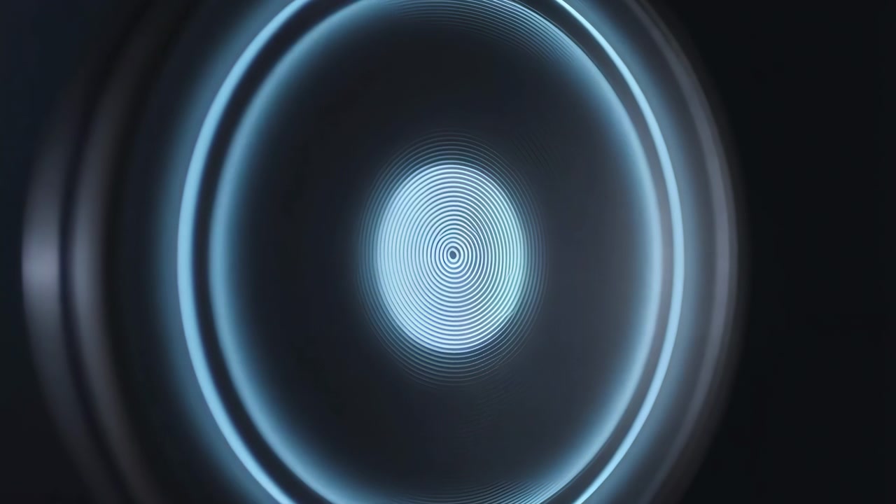 Tight close-up on glossy curved glass or optical lens with bright blue-white concentric rings, central target glow, faint oval bands, dark cool background, smooth reflective texture and balanced