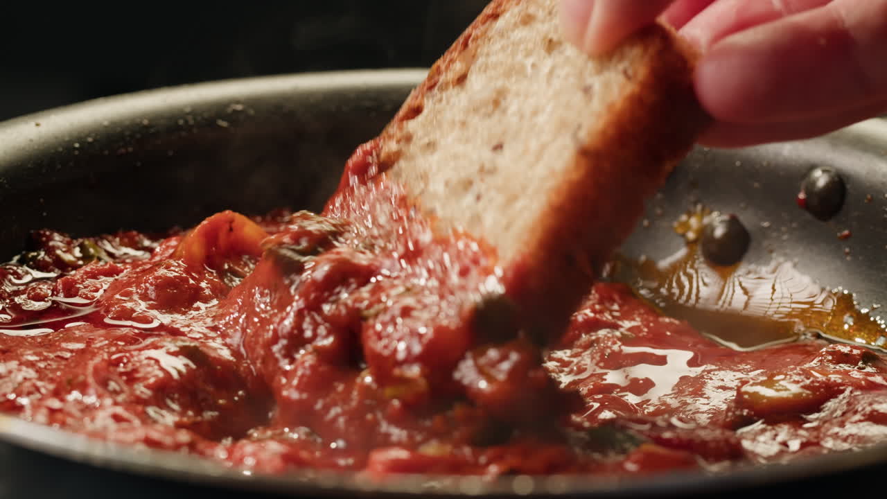 Dipping Bread in Tomato Sauce