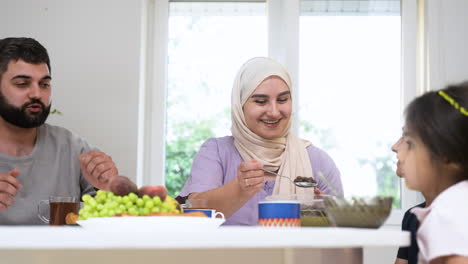 Close-up-view-of-islamic-family-having-breakfast.