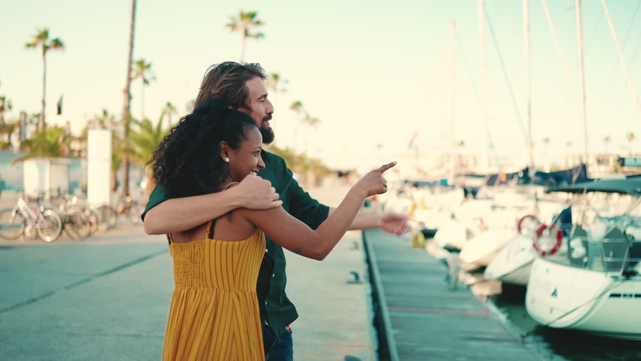 Couple hugging at the harbor