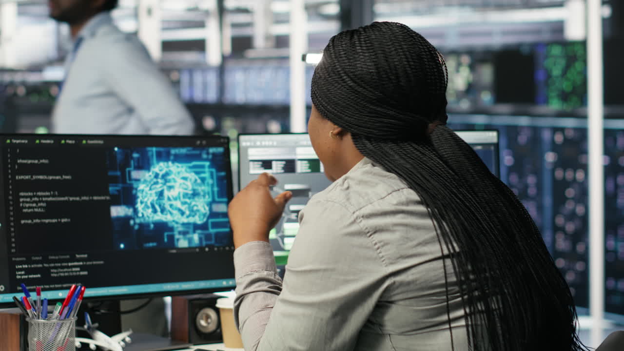 Data center staff member in office using AI deep learning algorithms