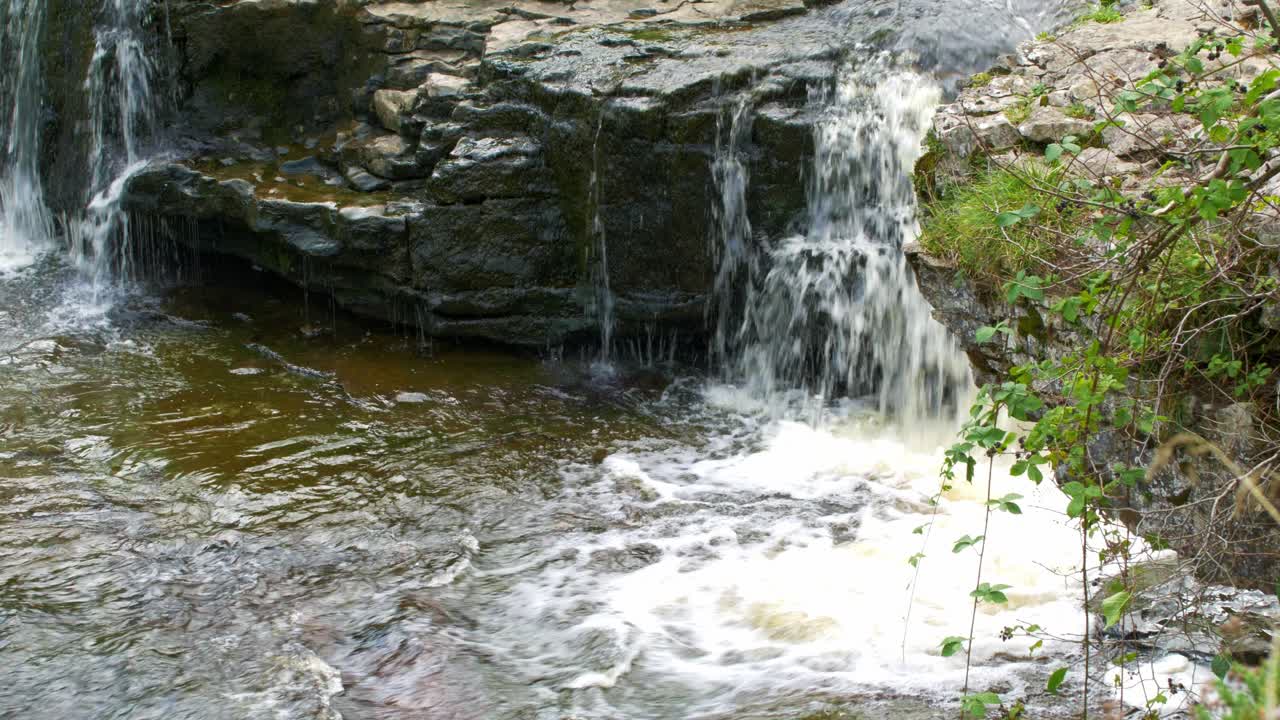 Beautiful flowing waterfall cascade Yorkshire on sunny day 4
