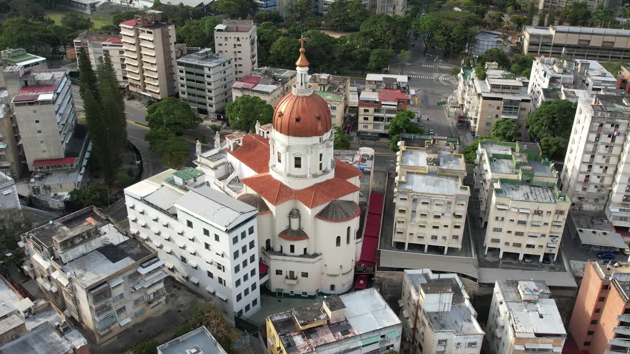 San pedro church in caracas, venezuela, surrounded by urban buildings, aerial view