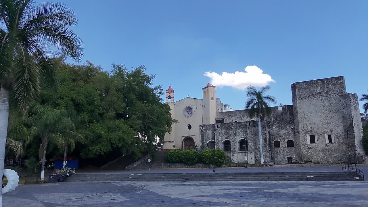 Old colonial church and ruins in Oaxtepec, Tlayacapan, Morelos under blue skies