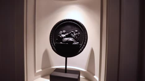 zoom in shot of greek artifacts.