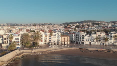 warm-morning-sun-illuminates-the-coastal-city-as-drone-captures-breathtaking-footage-of-endless-houses-stretching-out-before-it