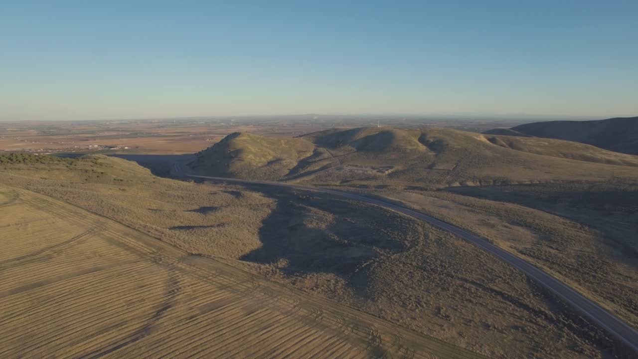 Aerial footage of a lonely desert highway.
