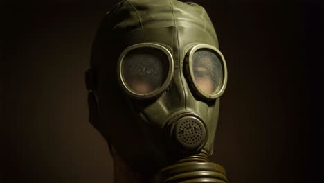 a close-up look at a vintage gas mask capturing the intricacies of survival gear amidst a dark background, highlighting the importance of safety in challenging environments