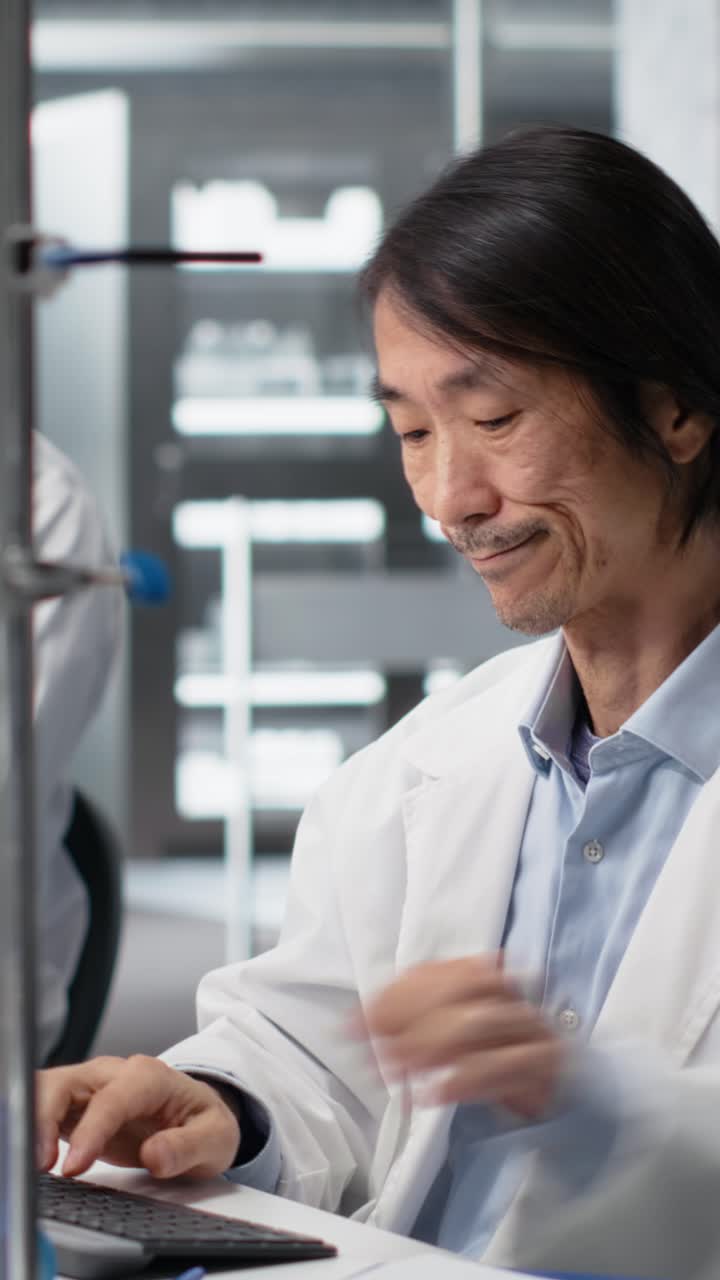 Vertical video Senior scientist tired while recording observations from laboratory experiment