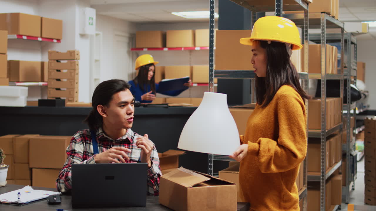 Warehouse workers managing inventory and shipping