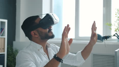 businessman experiencing virtual reality in office