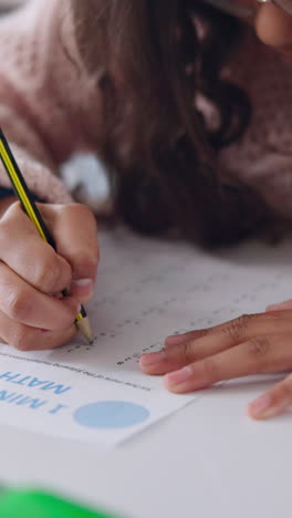 young girl doing math homework