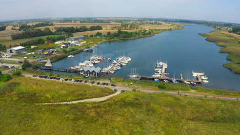 aerial panoramic view of drone flying to yachts in marina, blotnik, pomeranian, poland