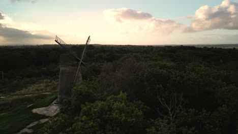 bidston windmill at dawn, aerial drone clockwise storm cloud reveal