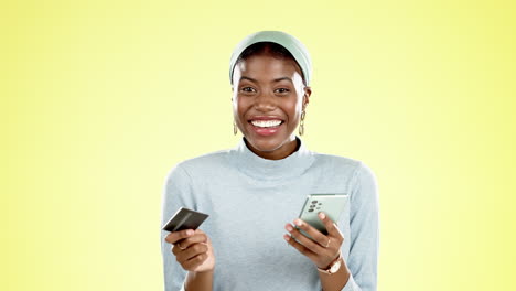 phone, credit card and face of a black woman