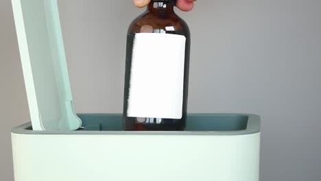 recycling a glass bottle