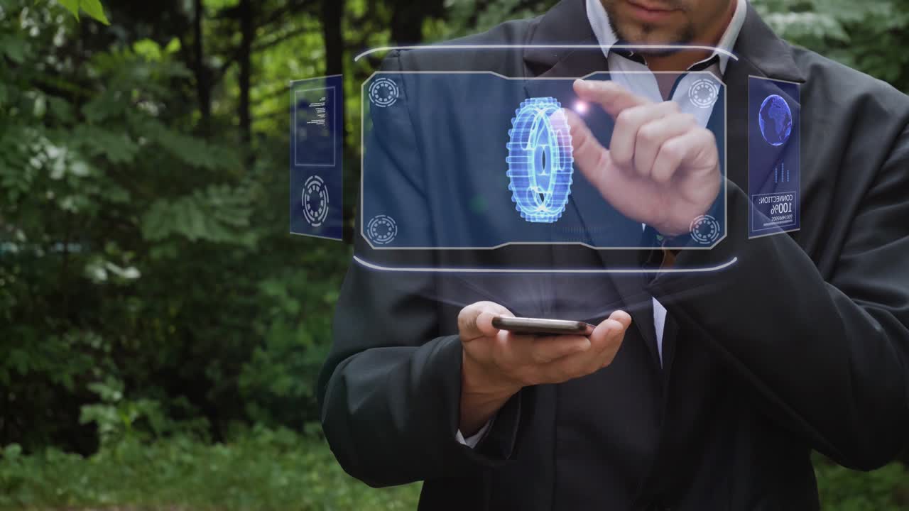 Businessman uses hologram with gear