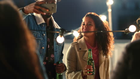 Friends,-phone-and-selfie-at-a-party-at-night