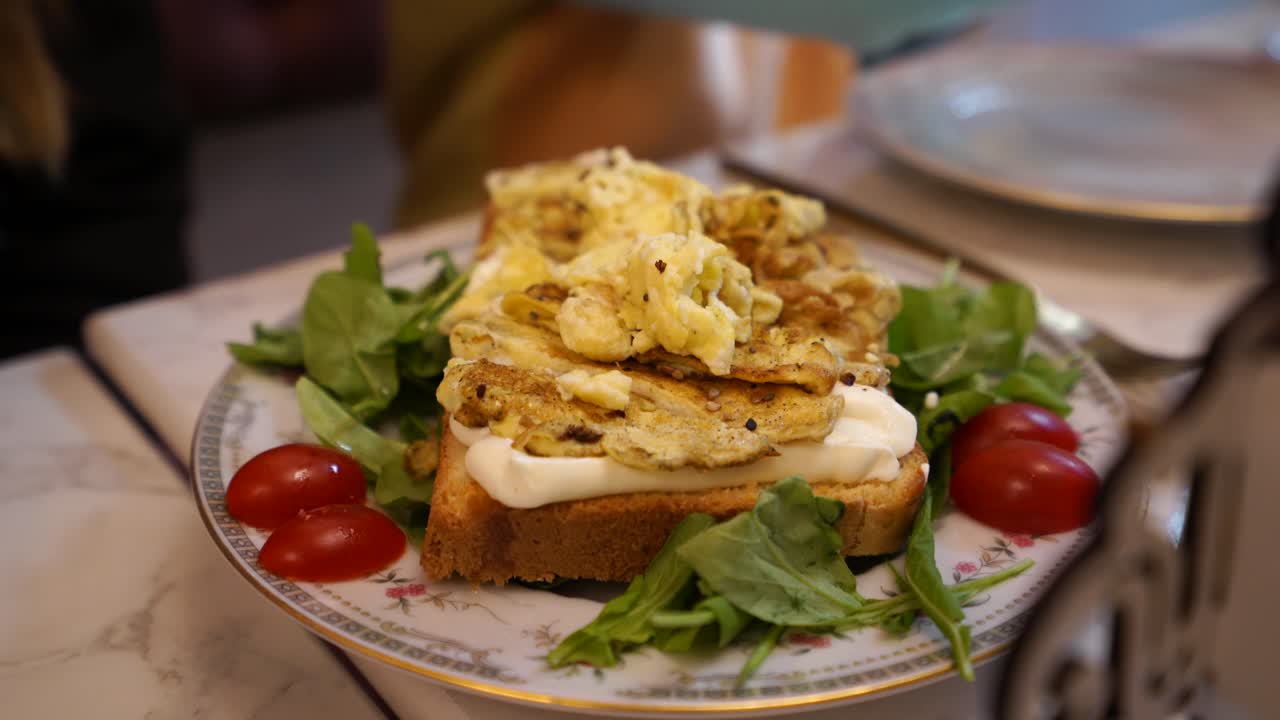 Healthy breakfast egg toast served with tomato, vegetables, cream cheese and white bread