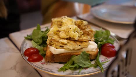 healthy breakfast egg toast served with tomato, vegetables, cream cheese and white bread