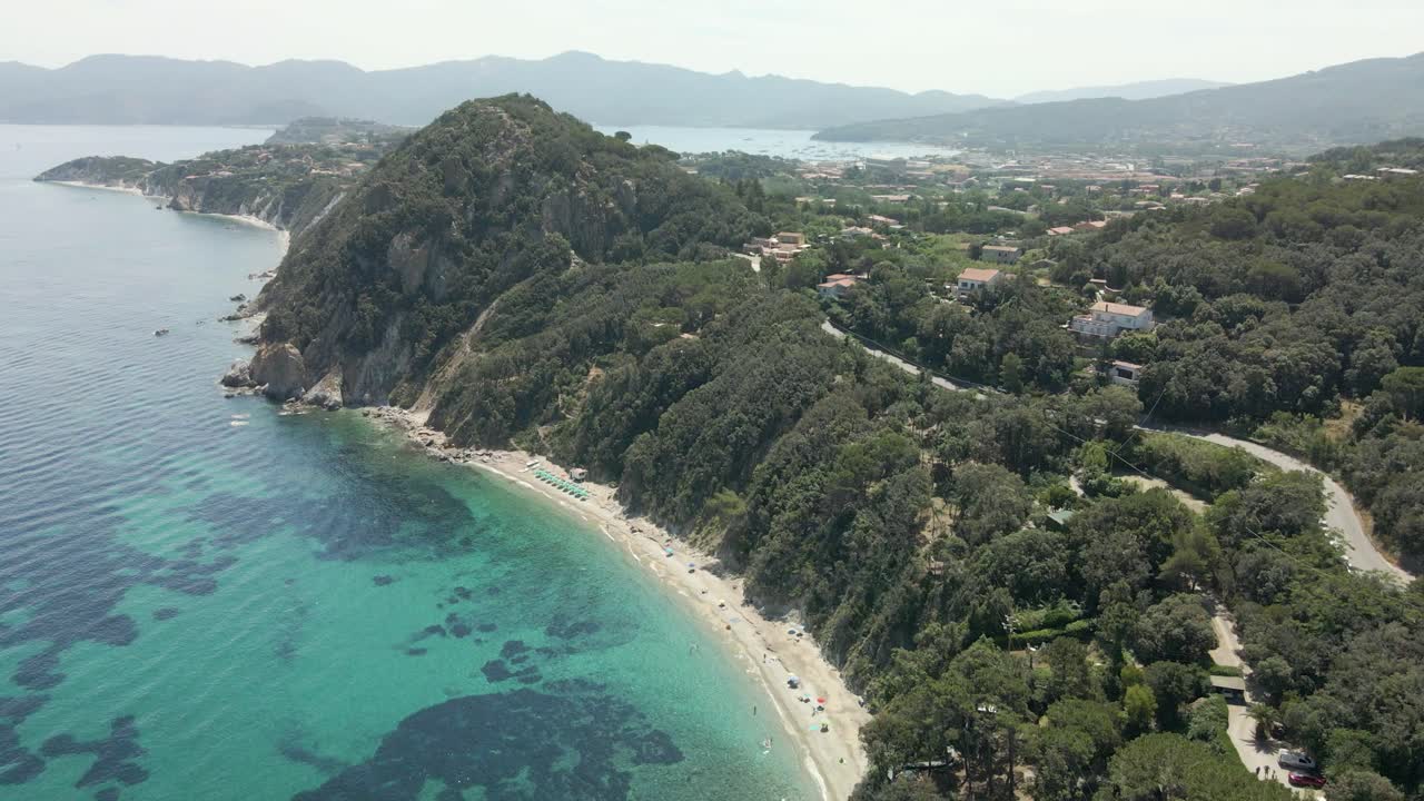 island of elba in italy mediterranean coast aerial images of the beach with turquoise blue waters, flight with drone european tourism