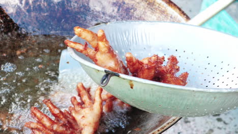 Extreme-close-up-deep-fried-chicken-feet-ready-to-serve---Handheld-motion