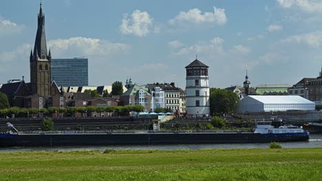 container vessel moves along the river rhine passing through dusseldorf