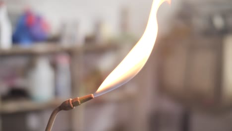 lighting propane torch with lighter. flame close up