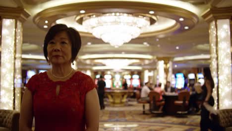 a narrative journey through a casino: a woman in red and a young man in a suit capturing the essence of excitement and anticipation in a lively gaming environment