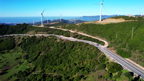 large wind turbine field supply wind energy near strait of gibraltar mountains and valley