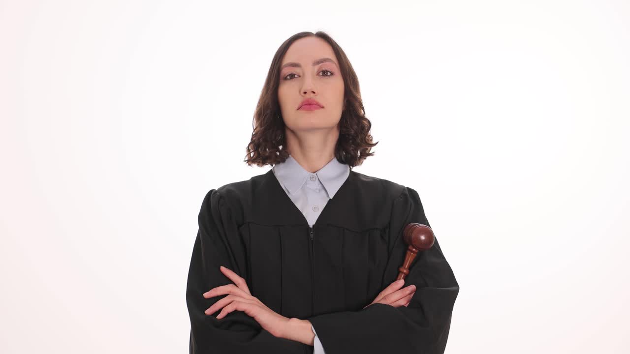 Serious Female Judge with Gavel and Crossed Arms