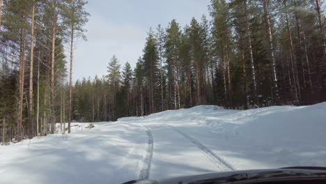Hyperlapse-video-of-snowy-and-curvy-forest-road-on-a-sunny-winter-day