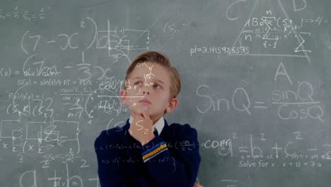 Student-standing-in-front-of-the-blackboard-with-calculations-on-the-foreground