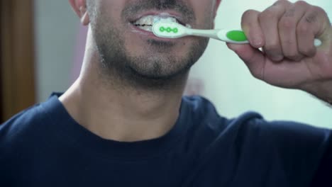 man brushing his teeth