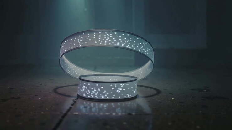 Glowing perforated rings rotating and tilting on worn tiled floor, overhead beam initiating motion