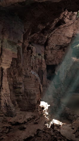 sunlight rays illuminating a deep cave interior