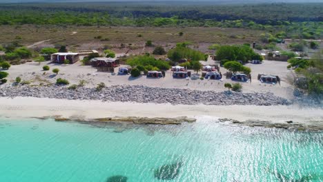 beautiful eco del mar seaside resort with ecological tent accommodations by turquoise sea water, dominican republic, overhead sideways aerial