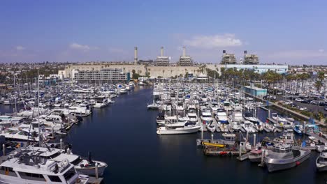 Close-up-aerial-dolly-shot-of-the-boat-landing-at-King-Harbor-Marina-in-Redondo-Beach,-California