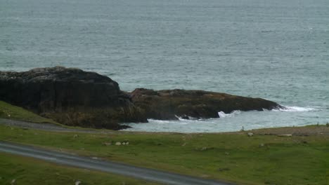 A-shot-of-rocks-by-the-sea-on-the-Isle-of-Harris,-part-of-the-Outer-Hebrides-of-Scotland