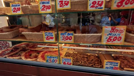 a variety of foods displayed at a street vendor