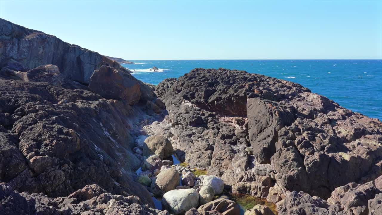 A hidden rock pool gulley in the cliffs near Tathra, New South Wales, Australia