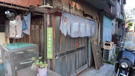 close-up of old abandoned shop in shopping street in tokyo japan