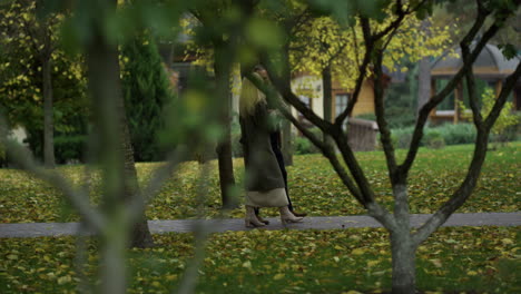 happy couple walking in foliage park