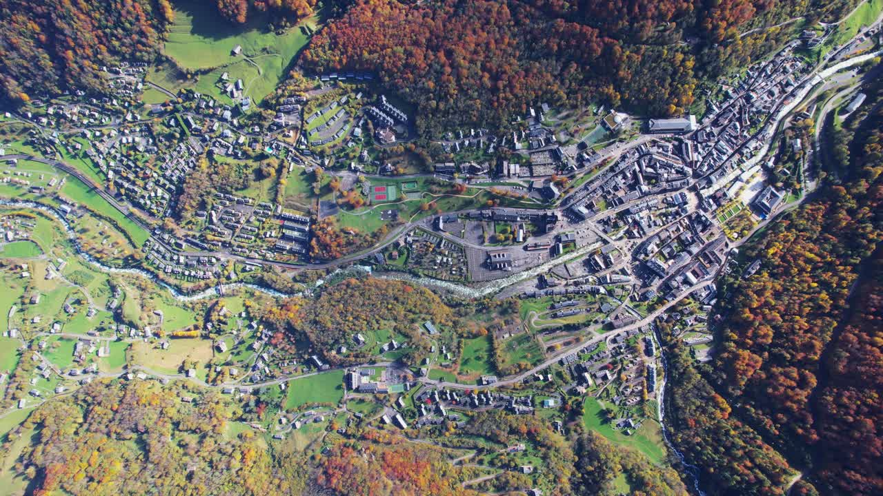 Aerial view of Cauterets spa town, vibrant autumnal colors, touristy vibe