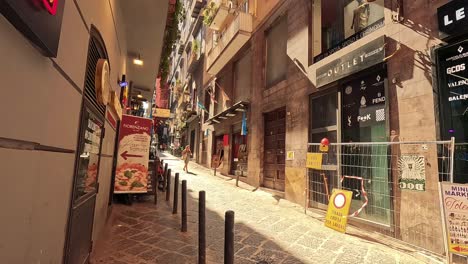 a vibrant street scene with shops and pedestrians