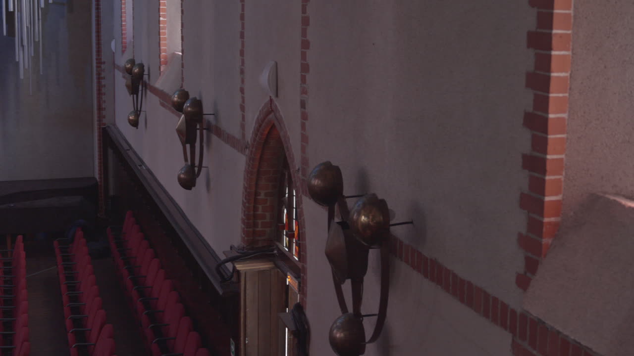 Stained glass window and brick wall